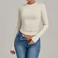 Slim fit long sleeve beige yoga top designed for high-intensity fitness and Pilates training - Cream Apricot