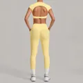 Women's light yellow two-piece yoga set with back cutout crop top and leggings - Durian Yellow