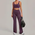 Purple two-piece yoga set featuring sports bra and high-waisted flared fitness leggings - Grape Purple