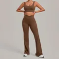 Two-piece brown yoga set for women featuring cross-waist flare leggings and a sports bra top. - Dark Brown