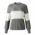 Close-up detail of a grey and white color-block sweater featuring lantern sleeves and crew neck - S / Tops / Gray