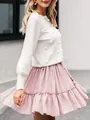 Detail shot of elegant white crew neck knit sweater featuring pom-pom decorations - S / Tops / White