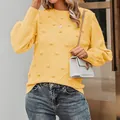 Elegant yellow crewneck knit sweater featuring playful pom-poms and V-pattern textures - Yellow