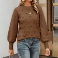 Close-up of brown knit sweater featuring 3D pom-poms and elegant lantern sleeves. - S / Tops / Coffee