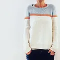 Detail shot of a women's tricolor knit sweater with light blue, orange and cream color blocking - 3XL / Tops / Apricot