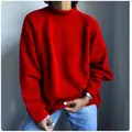 Detail view of a vibrant red oversized knitted pullover sweater in a casual style - S / Tops / Red