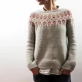 Close-up detailed view of women's gray knit sweater with orange Nordic pattern yoke - 3XL / Tops / Khaki