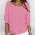 Close-up detail of a pink elegant knit top with a boat neck and 3/4 sleeves on a model. - 3XL / Tops / Pink