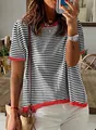 Close-up of striped short sleeve knit top with red contrast trim and dropped shoulders - S / Tops / White