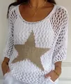 Detail of white crochet knit top featuring a large gold star and 3/4 sleeves. - S / Tops / White