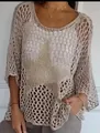 Close-up detail of beige hollow-out knit sweater featuring a star pattern and 3/4 sleeves - S / Tops / Khaki