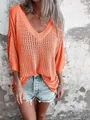 Close-up detail of a bright orange hollow-out knit sweater featuring a stylish V-neck - 3XL / Tops / Orange Red