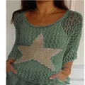 Detailed macro shot of women's sage green crochet knit top with a large sequined star pattern - Ocean Green