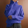 Close-up detail of purple high-neck knitted sweater with diamond pattern texture - S / Tops / Blue