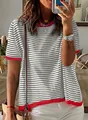 Close-up detail view of a grey and white striped knit top with vibrant red ribbed trim. - S / Tops / Silver Gray