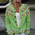 Detailed view of women's loose green knitted cardigan with vibrant colorful patterns - S / Tops / Light Green