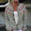Front view of a gray knitted cardigan with colorful diamond patterns and wooden buttons - S / Tops / Gray