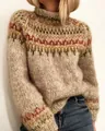 Detailed view of the chunky knit texture and geometric pattern of this high-neck sweater. - S / Tops / Apricot
