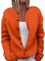 Close-up of the vibrant orange chunky knit texture and brown decorative buttons on cardigan - S / Tops / Orange Red