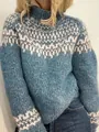 Close-up of blue and white Fair Isle knit pattern on a cozy turtleneck sweater. - S / Tops / Aqua