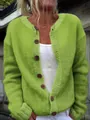 Detail view of a loose lime green knitted cardigan with large brown button closures - S / Tops / Green