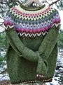 Detailed close-up of the Fair Isle yoke pattern on a green knitted round neck sweater - S / Tops / 9123-Dark Green