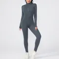 Full-view of a slim-fit gray yoga jumpsuit featuring a front zipper and long sleeves. - S / Top And Bottom / Gray