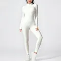 Detailed view of women's white long-sleeved one-piece yoga jumpsuit with zipper - S / Top And Bottom / White