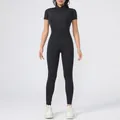 Full-length view of black short-sleeved fitness jumpsuit with front zipper detail - S / Top And Bottom / Black