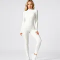 Detail van een witte yoga jumpsuit met lange mouwen en fleecevoering voor fitness. - Wit