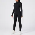 Detail of women's black fleece-lined long-sleeve yoga bodysuit with front zipper - S / Top And Bottom / Black