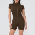 Detailed view of dark brown short-sleeved yoga jumpsuit with functional front zipper design - S / Top And Bottom / Coffee
