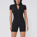 Detailed view of a women's black zip-front short sleeve athletic yoga jumpsuit - S / Top And Bottom / Black