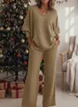 Close-up of elegant golden glittery two-piece V-neck sweatshirt and wide-leg pants set - Khaki