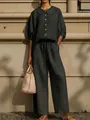 Detail view of cotton linen shirt with Peter Pan collar and matching wide-leg pants - XS / Top And Bottom / Black