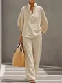 Detail of women's beige linen-style two-piece set with buttoned top and wide-leg trousers - S / Top And Bottom / Apricot