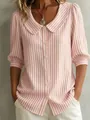 Detailed close-up view of a pink and white striped shirt featuring a stylish Peter Pan collar - S / Tops / Pink