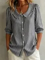 Stylish black and white striped blouse featuring a Peter Pan collar and puff sleeves - XS / Tops / Black