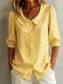 Close-up of yellow and white striped blouse featuring a Peter Pan collar and button-down - XS / Tops / Yellow