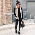 Casual beige sherpa vest styled with black leggings in an outdoor street setting - 3XL / Tops / Khaki