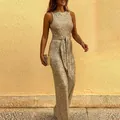 Detailed view of women's round neck sleeveless sequin jumpsuit with tie waist. - S / Top And Bottom / Gold