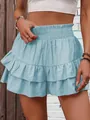 Detailed close-up of a light blue smocked waist ruffled skort with a layered design - S / Bottoms / Sky Blue