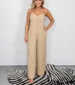 Elegant beige pleated wide-leg jumpsuit with spaghetti straps and V-neckline - S / Top And Bottom / Apricot