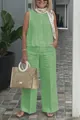 Close-up of a casual green sleeveless linen top and wide-leg trousers set on a model - S / Top And Bottom / Light Green