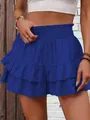 Detailed view of the royal blue ruffled hem and elastic waist on the summer skort. - S / Bottoms / Blue
