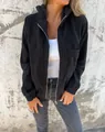 Vista dettagliata della giacca con cappuccio in velluto a coste nero con zip e tasca - Taglia S / Top / Nero