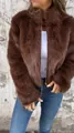 Detailed view of a stylish brown faux fur high-collar jacket with a metal zipper. - S / Tops / Dark Brown