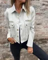 Close-up detail of stylish grey suede jacket featuring gold buttons and zipper pockets - S / Tops / White