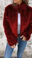 Close-up detail of women's red faux fur jacket with high collar and silver zipper closure - S / Tops / Red