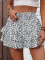 Detail view of a white floral tiered ruffle skort featuring a high elastic waist design - S / Bottoms / Grey Floral Print
